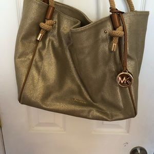 MK gold fabric purse.